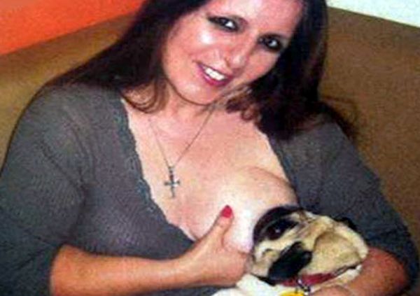 Terri Graham breast-feeds her puppy